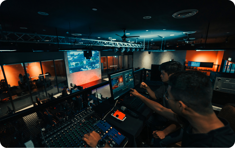 People managing audio and visual equipment