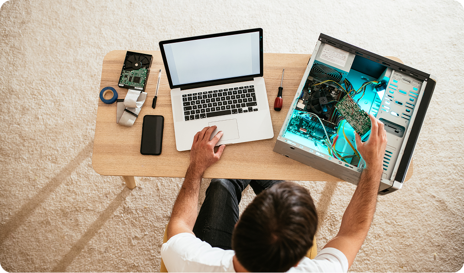 Person repairing computer with open case