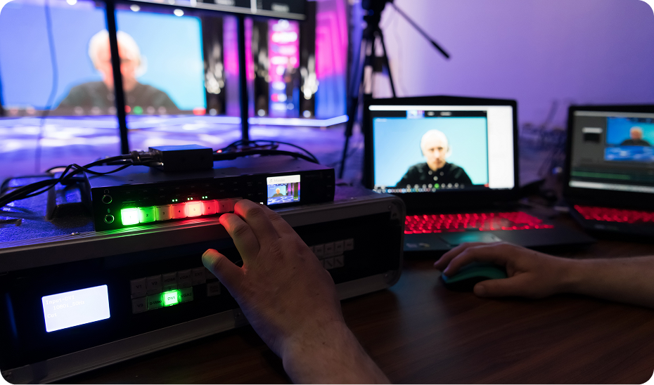 Hands operating video broadcasting equipment